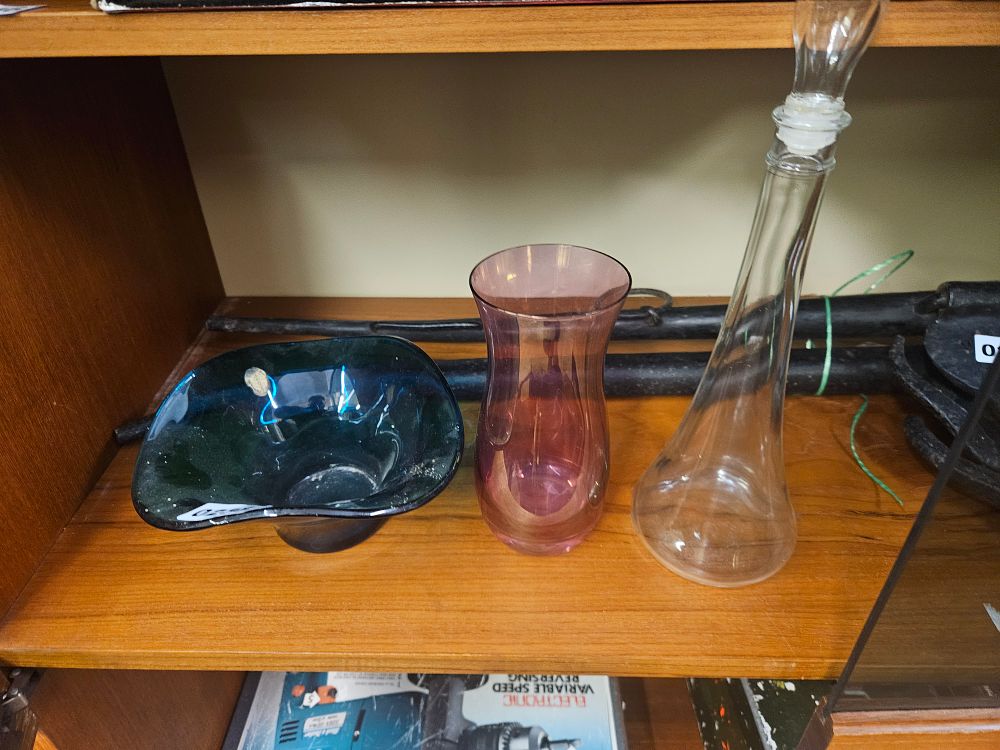 Lot 238 – A Trio of Decorative Glassware comprising a Teal Art Glass Bowl, an Amethyst Vase, and a Clear Glass Decanter