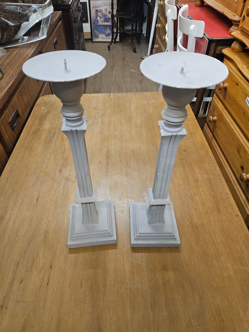Lot 243 – A Pair of Tall Neoclassical Style Painted Cast Metal Columnar Pricket Candlesticks