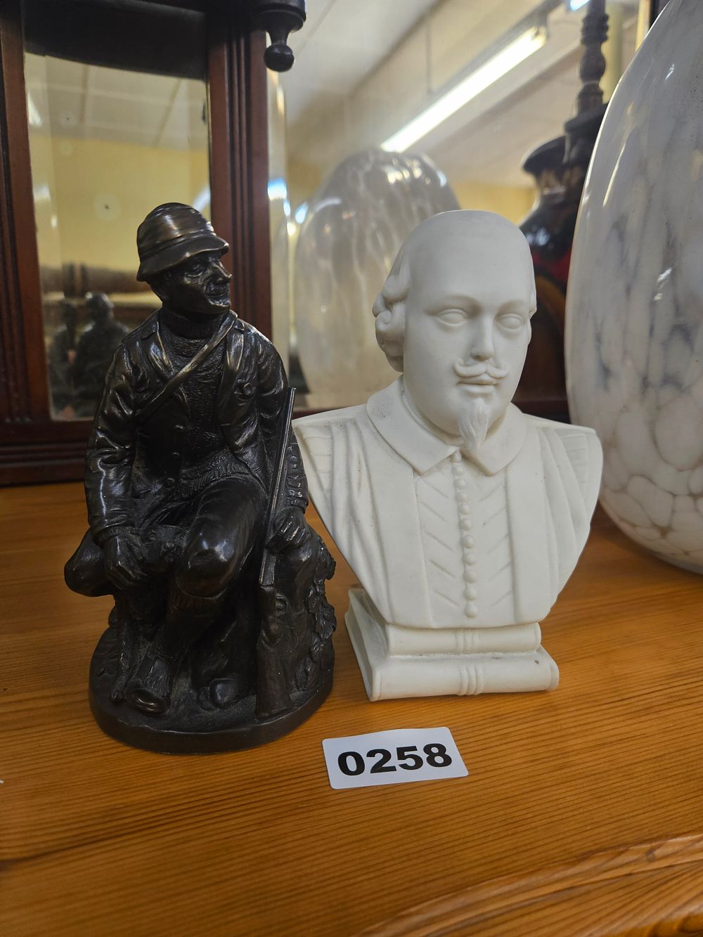 Lot 258 – Two Figurines comprising a Parian Ware Bust of William Shakespeare and a Patinated Metal Soldier