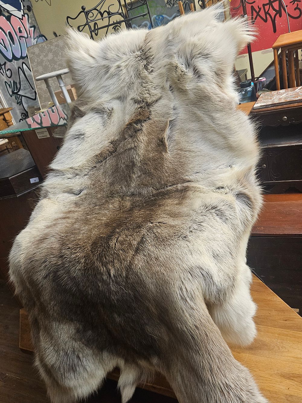 Lot 273 – A Large Natural Reindeer Hide Decorative Rug