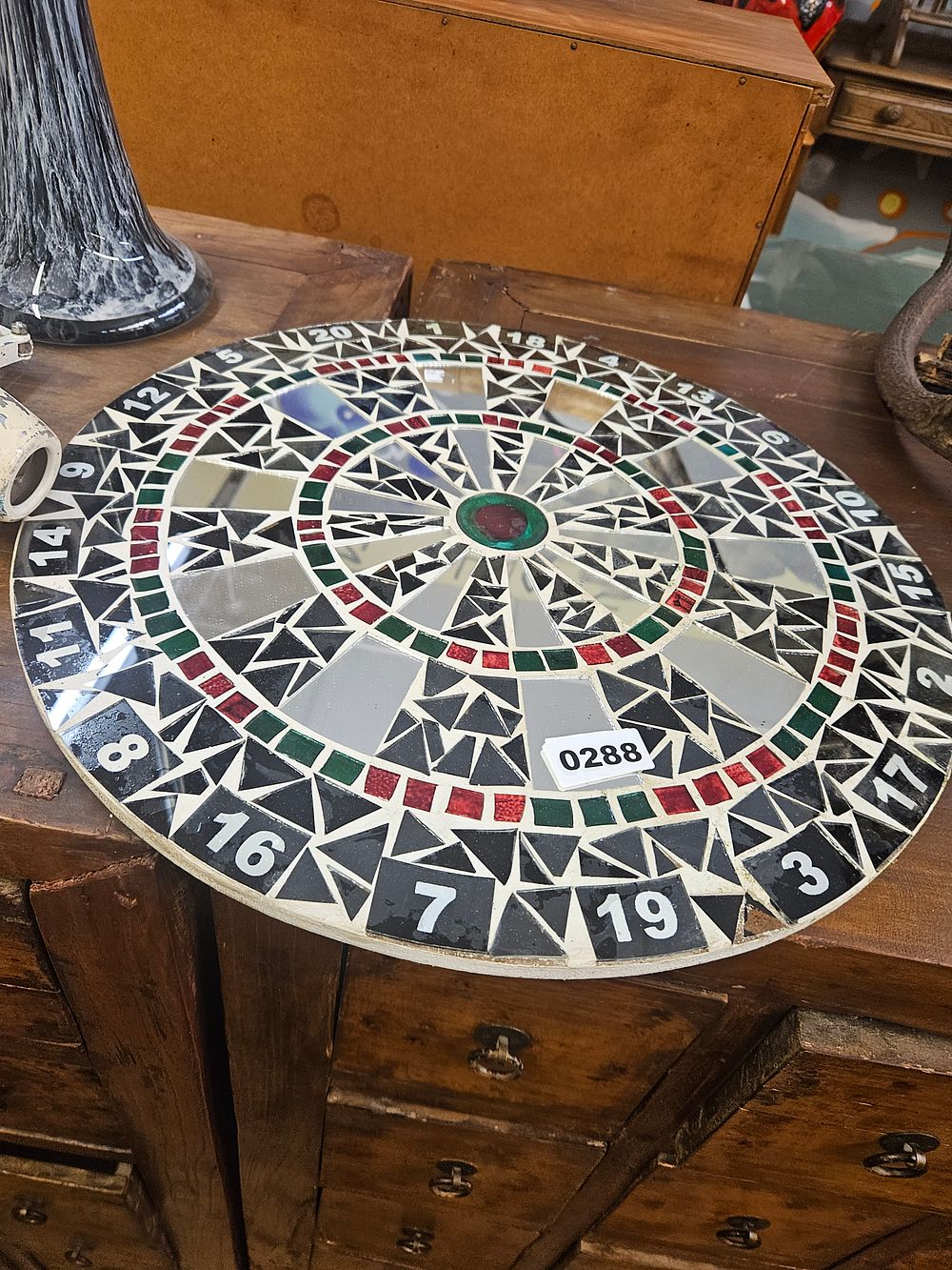 Lot 288 – A circular mosaic wall mirror in the style of a dartboard