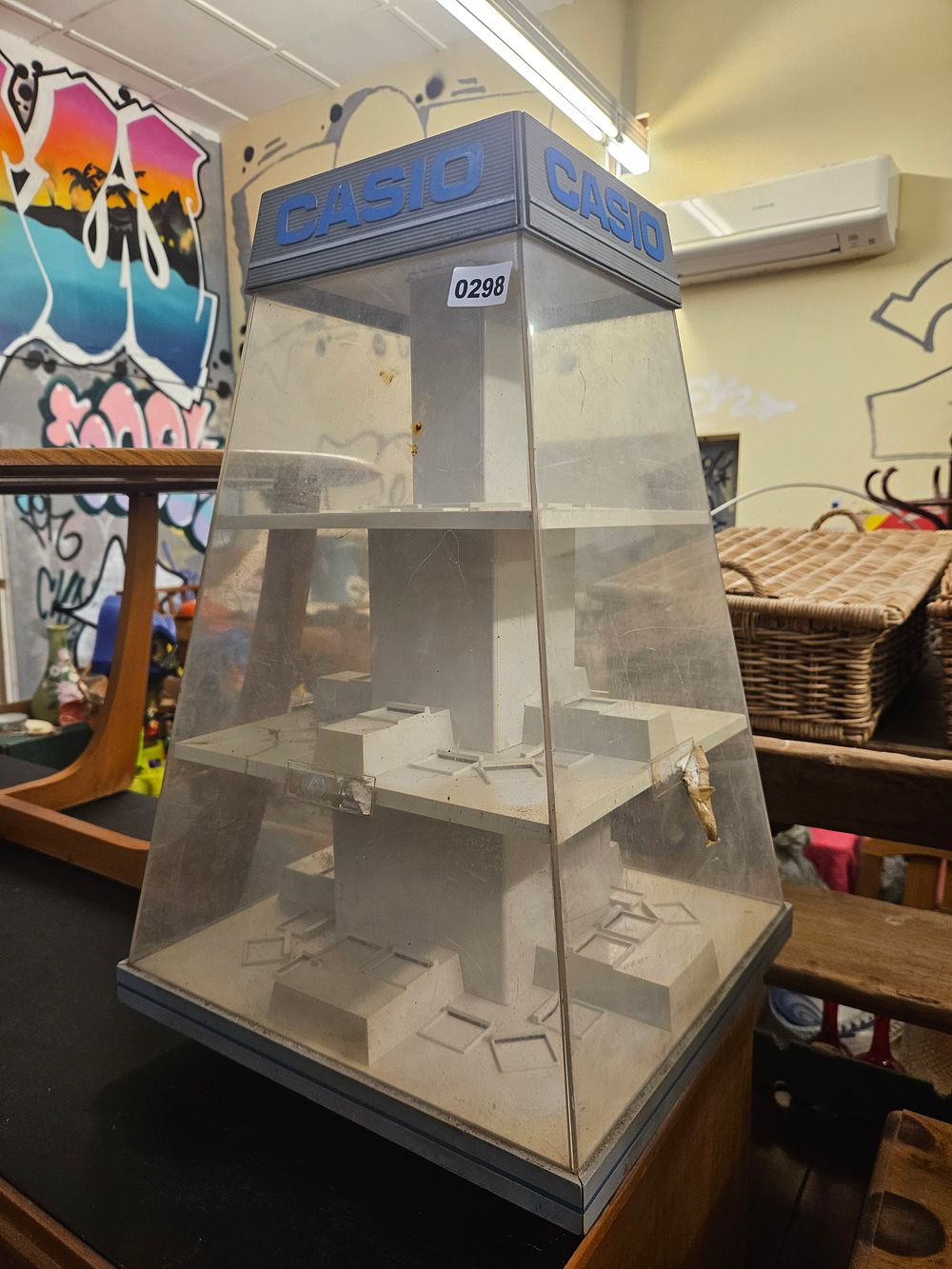 Lot 298 – A Vintage Casio Branded Multi-Sided Acrylic Countertop Retail Display Cabinet
