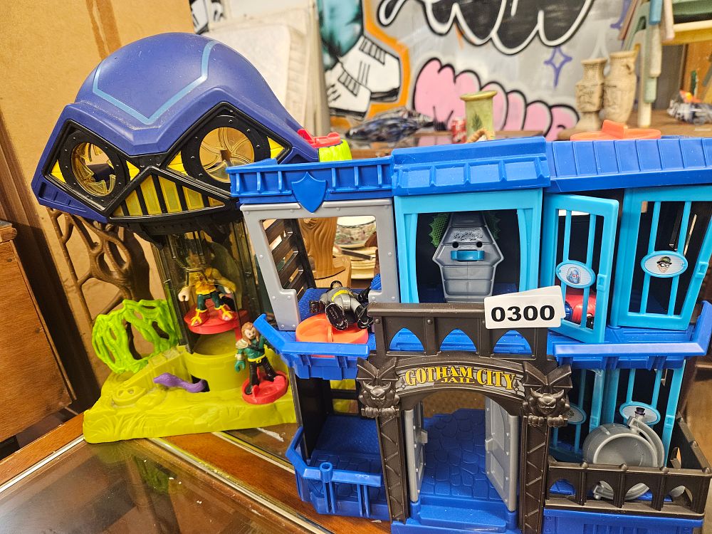 Lot 300 – Two Fisher-Price Imaginext DC Super Friends Playsets and Three Figures