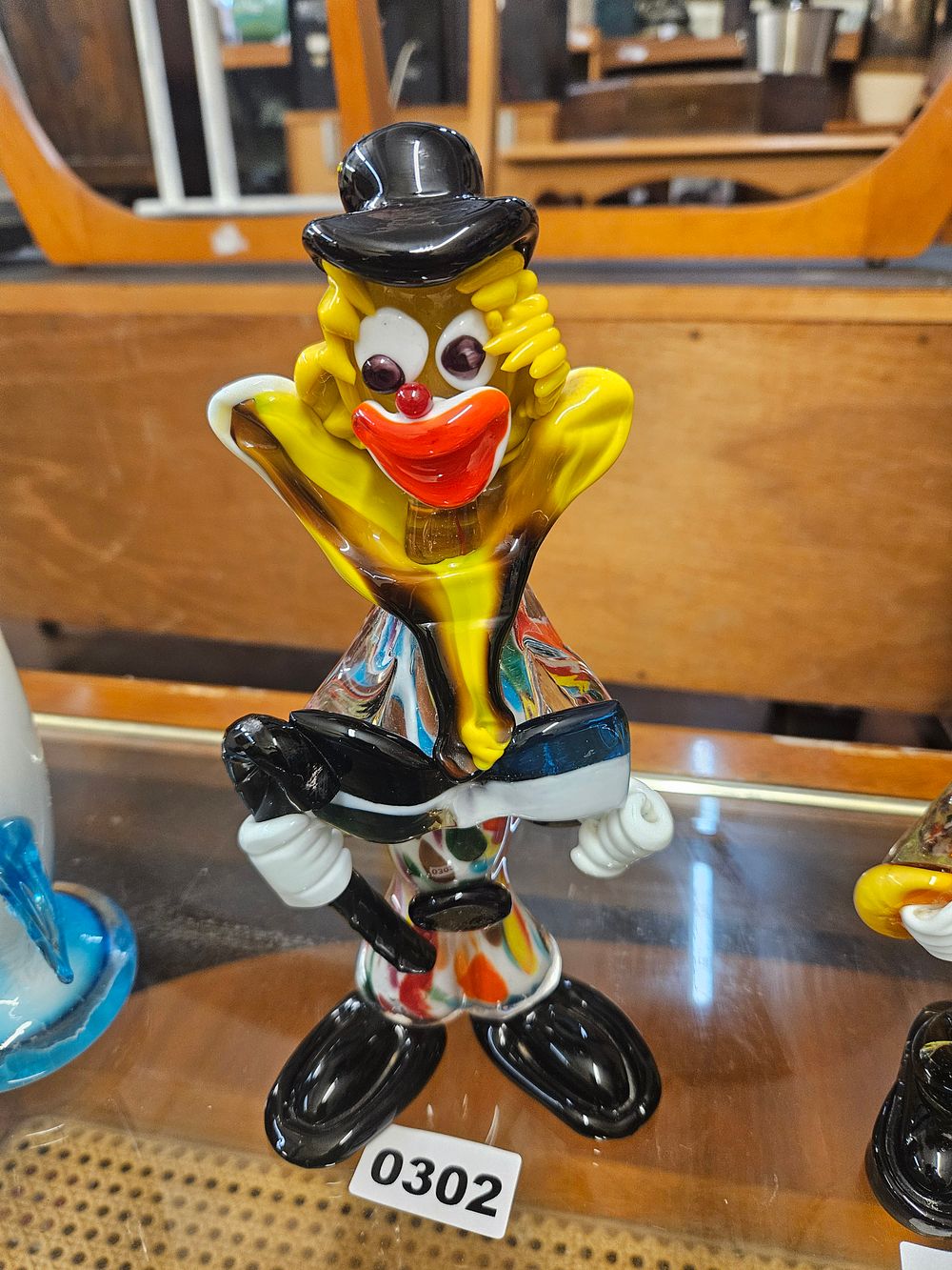 Lot 302 – A Murano Style Hand-Blown Polychrome Art Glass Musical Clown Figurine