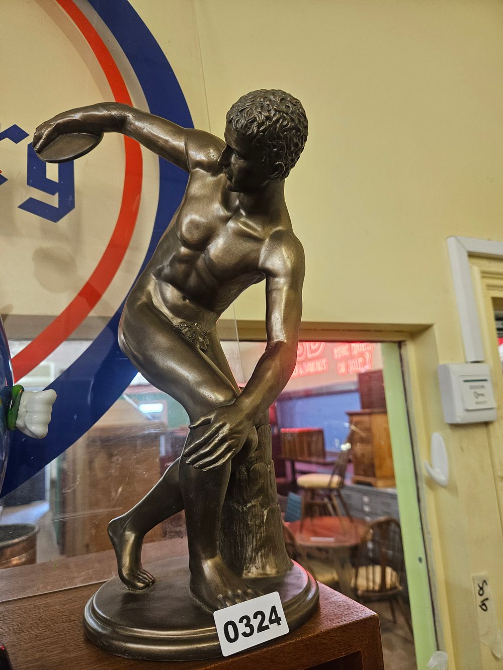 Lot 324 – A Bronze-Patinated Sculpture of the Standing Discobolus After the Antique