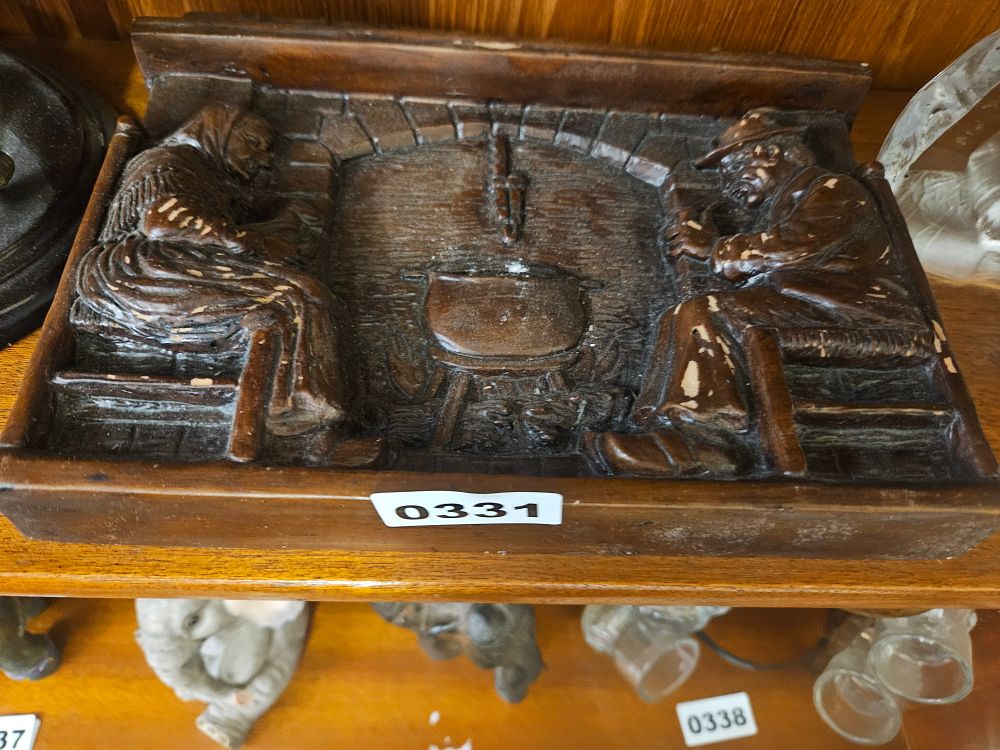 Lot 331 – A Carved Relief Panel Depicting a Rustic Hearth Scene