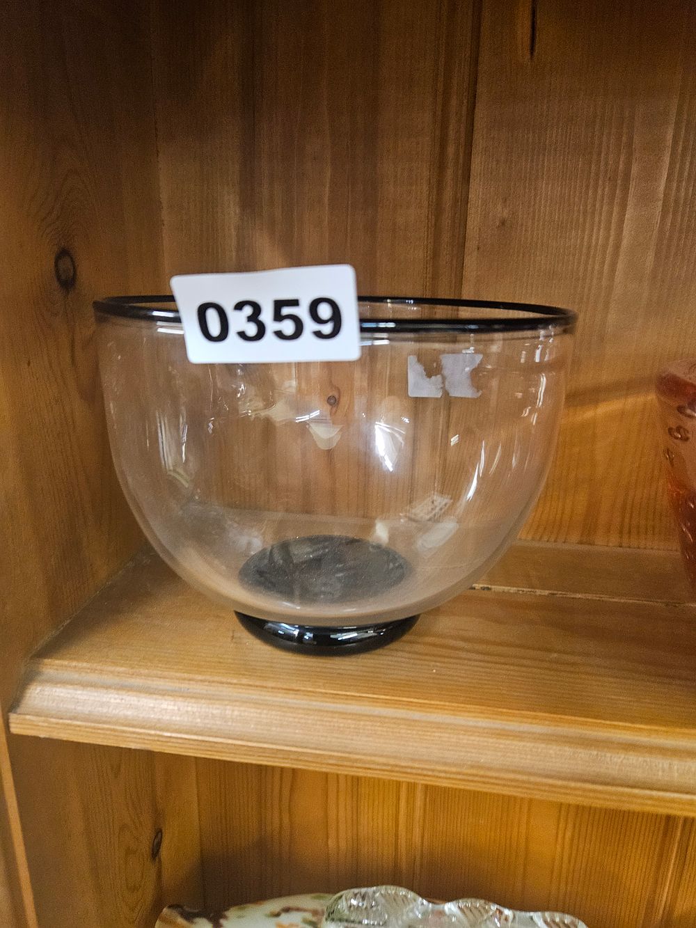 Lot 359 – A Mid-Century Modern Style Clear Glass Bowl with Black Rim and Base