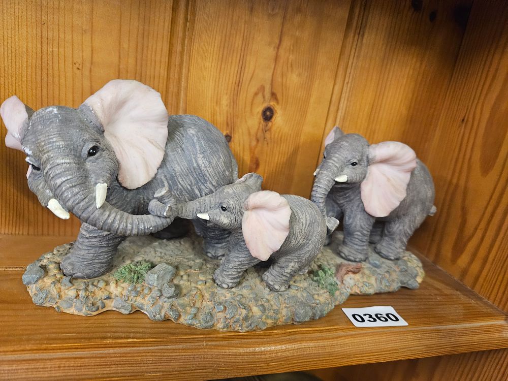 Lot 360 – A resin figurine group of an elephant family