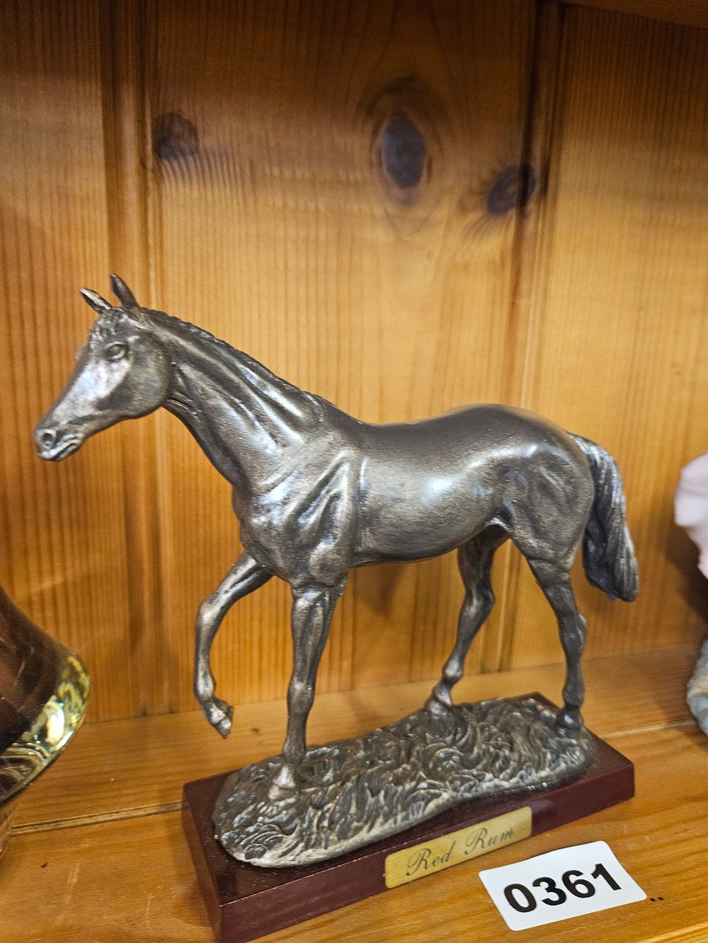 Lot 361 – Cast resin Figurine of Red Rum on Wooden Plinth
