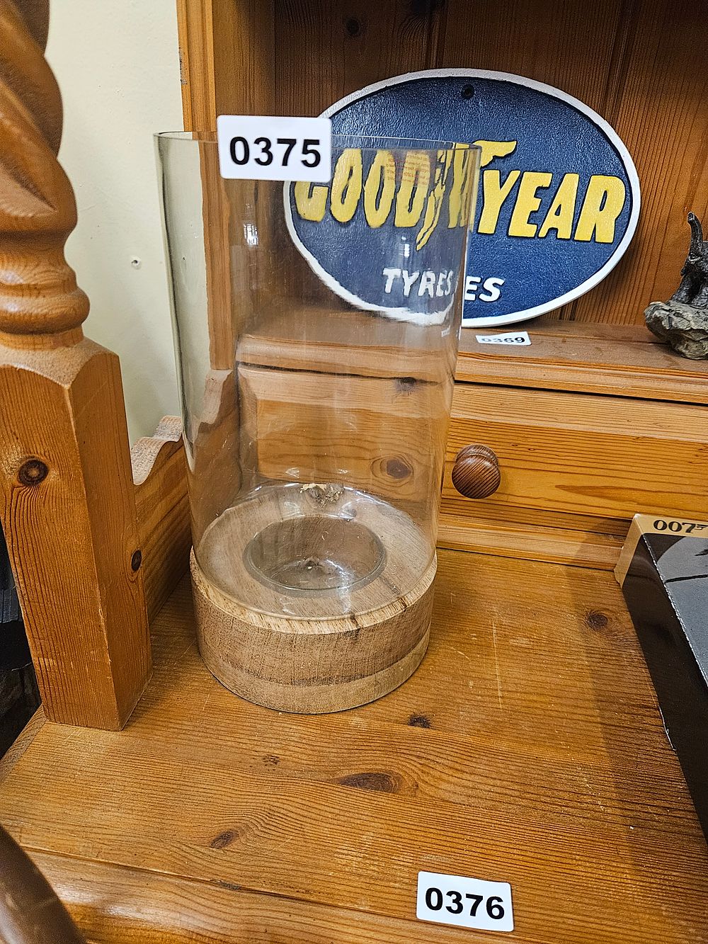 Lot 375 – A Scandi Style Glass and Wood Hurricane Candle Holder