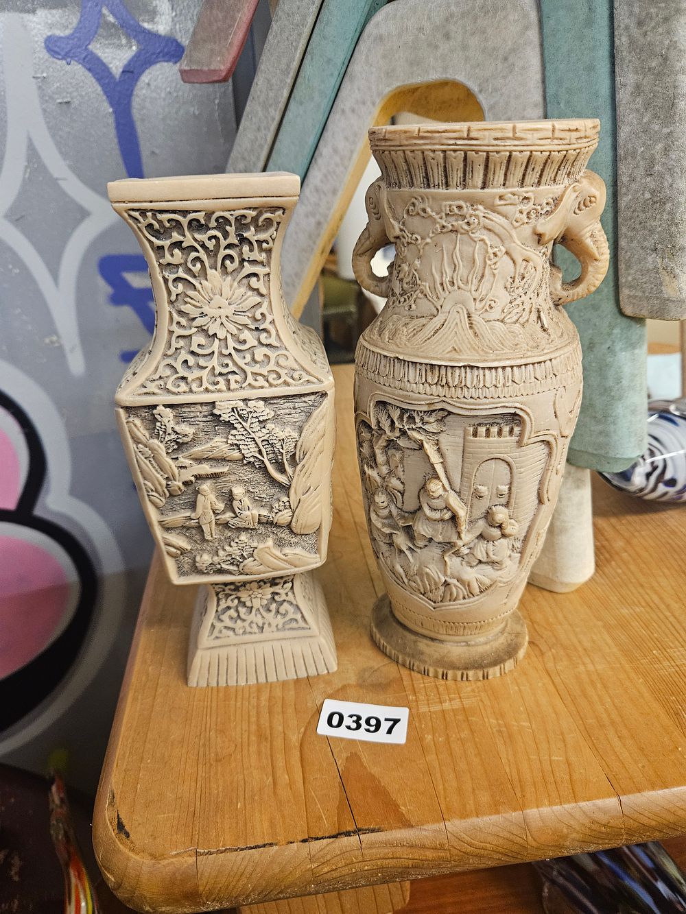 Lot 397 – Two Chinese style decorative moulded resin vases