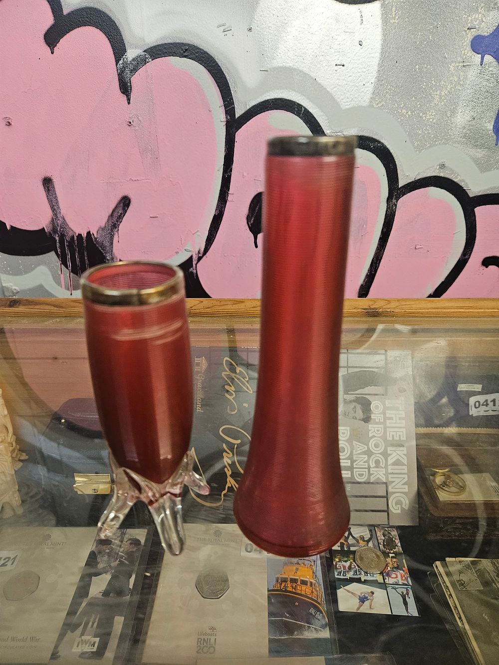Lot 408 – A Pair of Cranberry Threaded Glass Vases with Sterling Silver Rims by John Grinsell & Sons