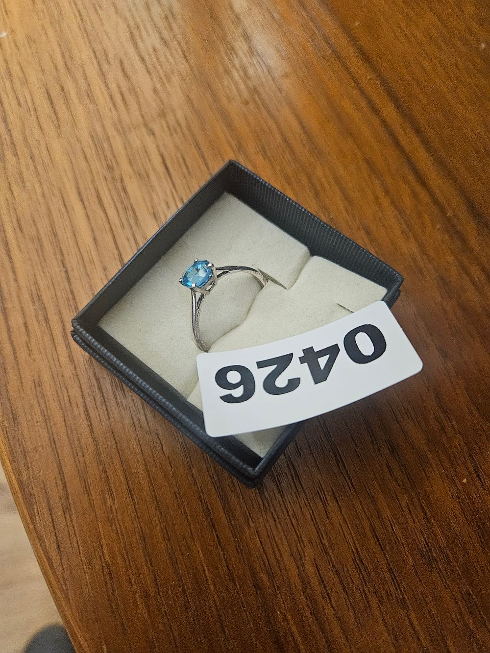 Lot 426 – A silver ring Solitaire Blue Topaz Style Ring