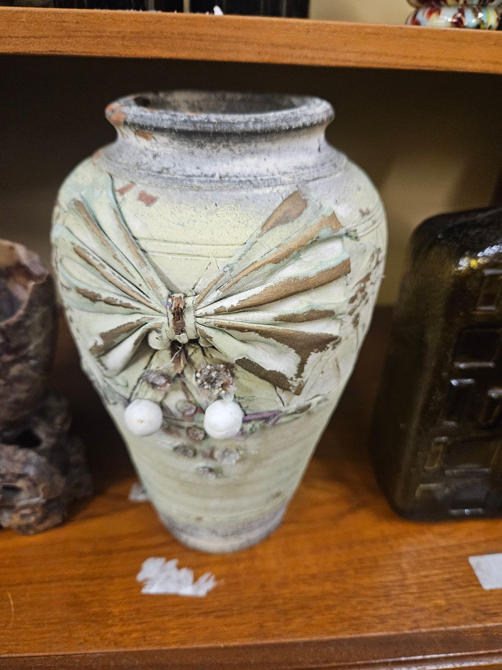 Lot 216 – A Studio Pottery Vase with Applied Relief Bow and Berry Decoration