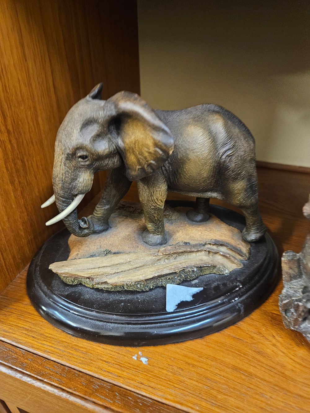Lot 218 – A Resinous Figurine of an African Elephant on a Circular Plinth