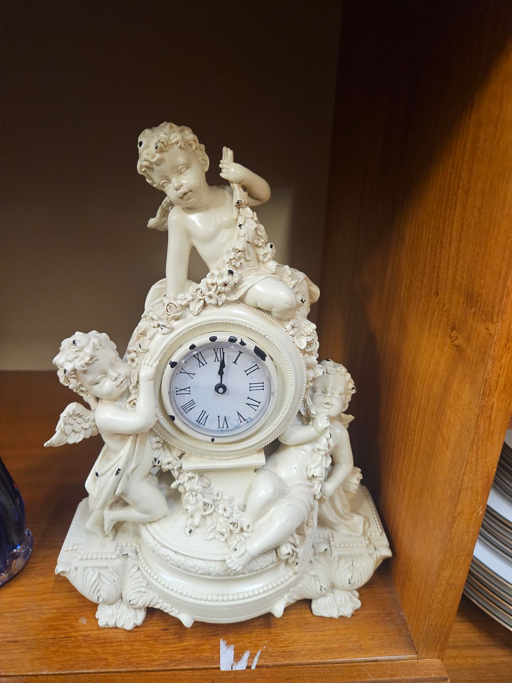 Lot 219 – A Rococo Style Composite Resin Mantel Clock Featuring Putti