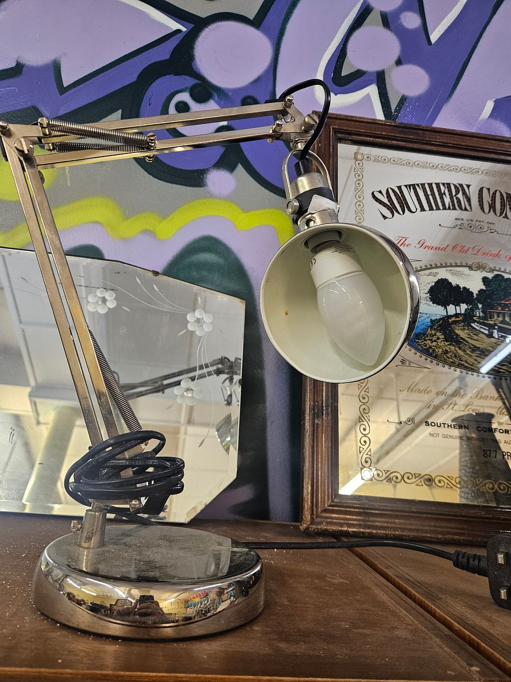 Lot 227 – A modern chrome-plated adjustable swing-arm desk lamp in the style of the IKEA FORSÅ model
