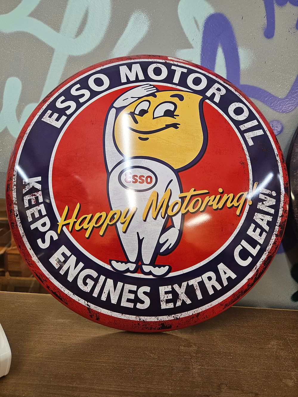 Lot 232 – A Circular Domed Esso Motor Oil Happy Motoring Advertising Sign