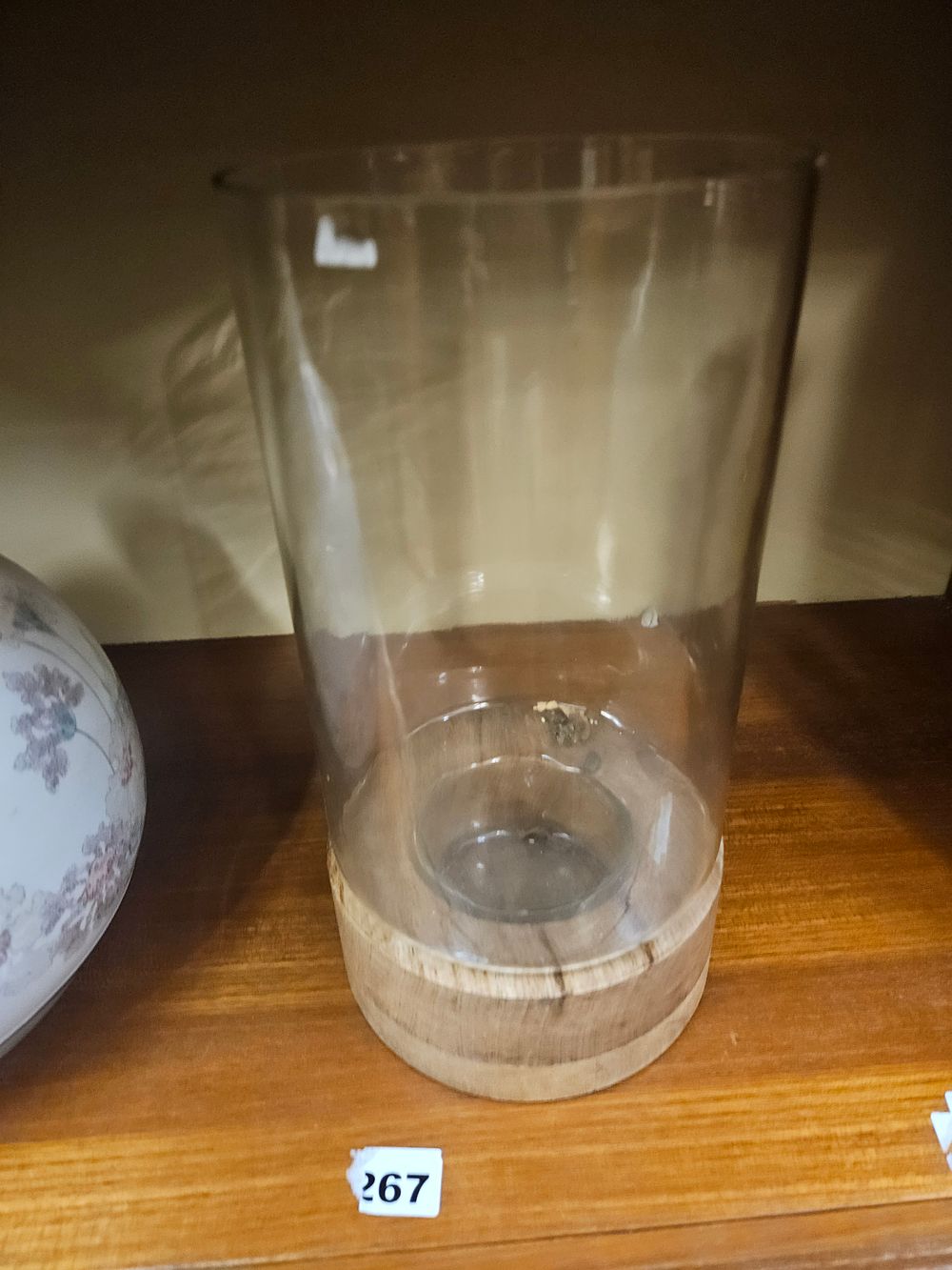 Lot 238 – A Glass and Wood Hurricane Candle Holder