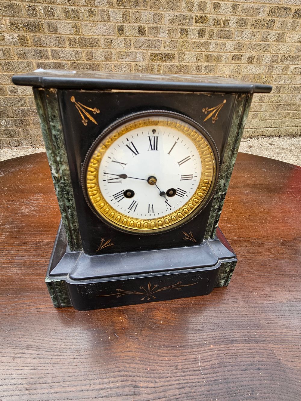 Lot 266 – A Late 19th Century French Black Slate and Green Marble Mantel Clock