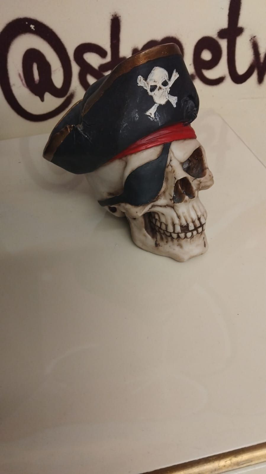 Lot 279 – A Decorative Pirate Themed Resin Skull Figurine