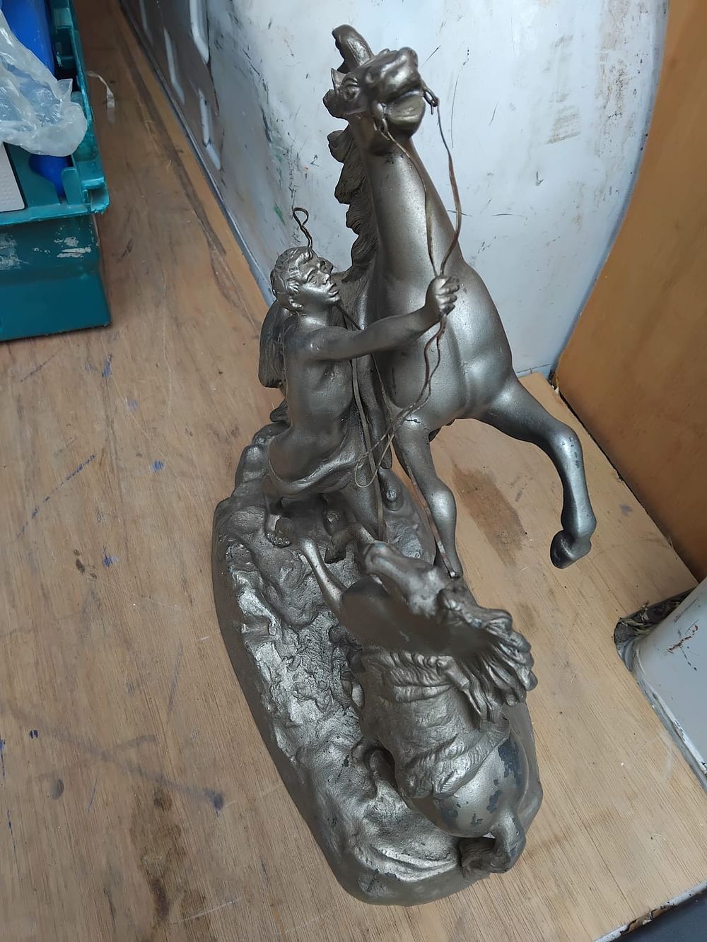 Lot 159 – A Silvered Spelter Figural Group in the Style of Guillaume Coustou depicting a Horse Tamer and Two Rearing Horses