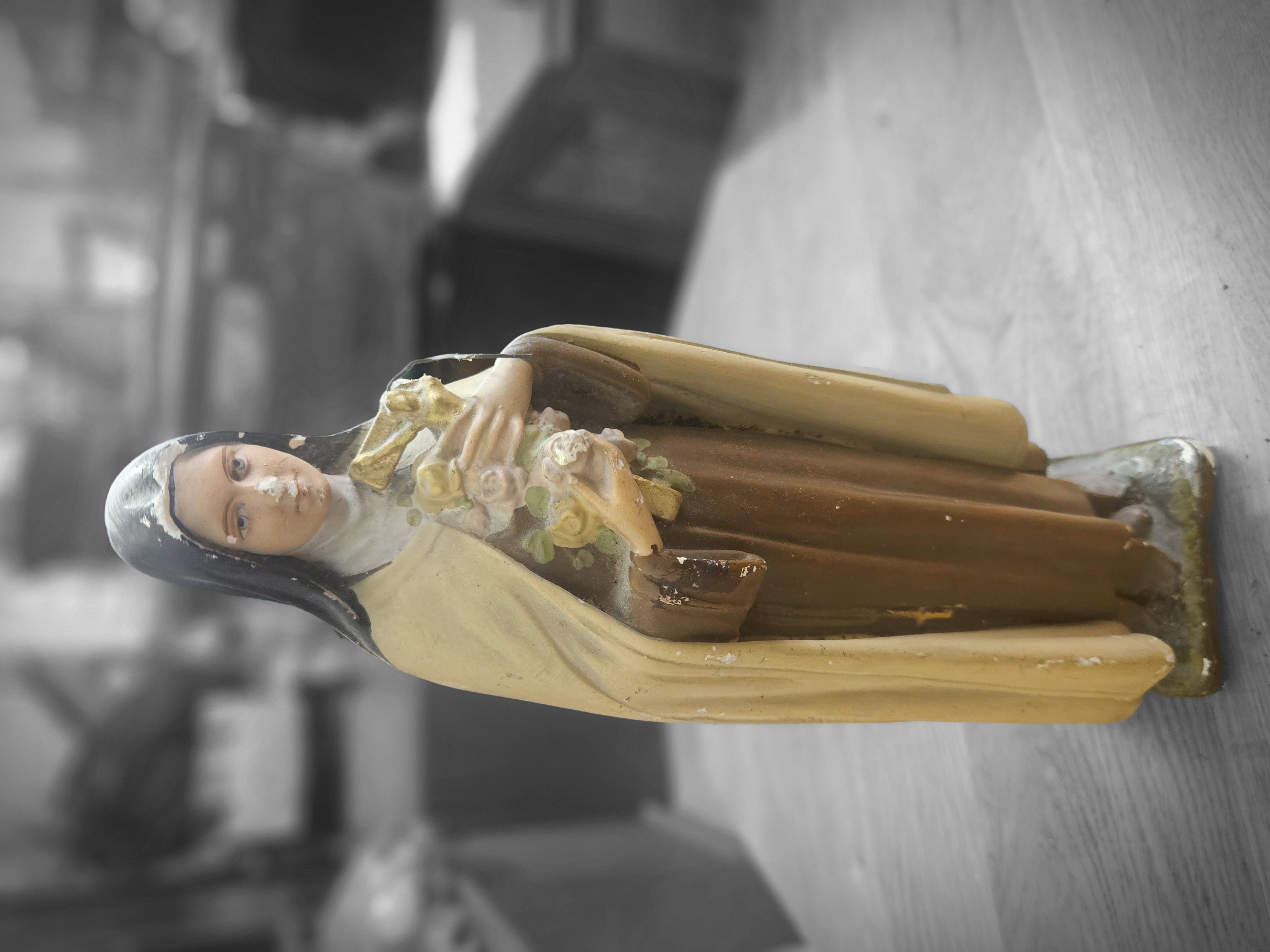 A vintage painted chalkware religious figurine of Saint Thérèse of Lisieux