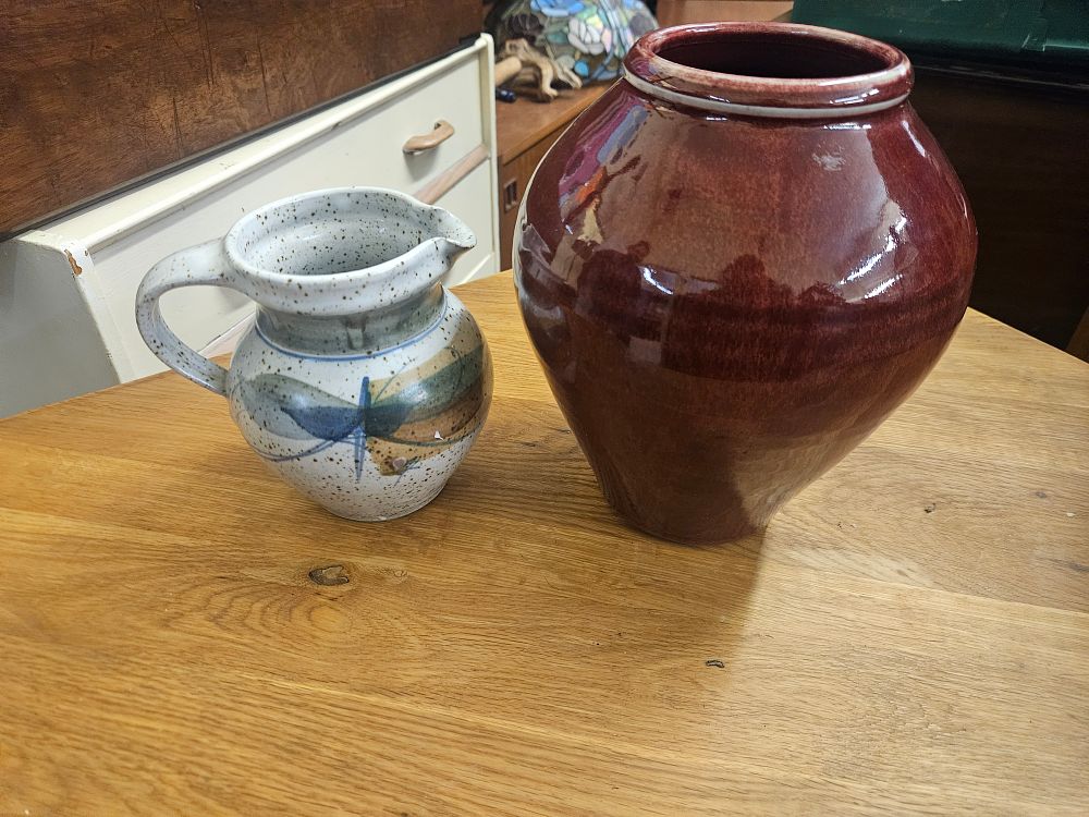 Lot 185 – Two Pieces of Studio Pottery comprising a Stoneware Dragonfly Pitcher and a Red Glazed Vase