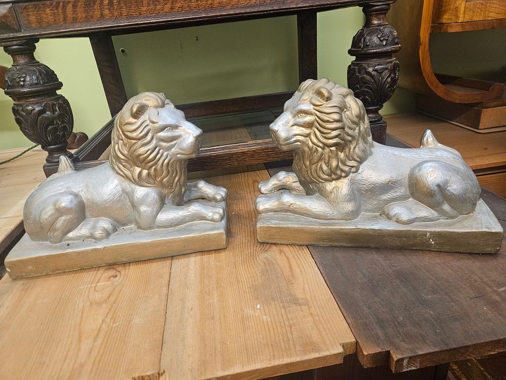 Lot 203 – A Pair of Vintage Metallic Painted Recumbent Lion Sculptures