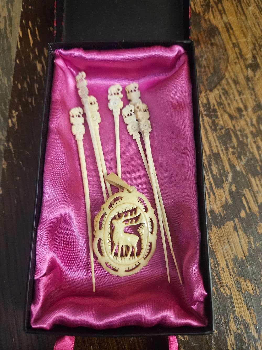 Lot 212 – A Group of Carved Bone or ivoru coloured Items Including Cocktail Picks and an Openwork Pendant