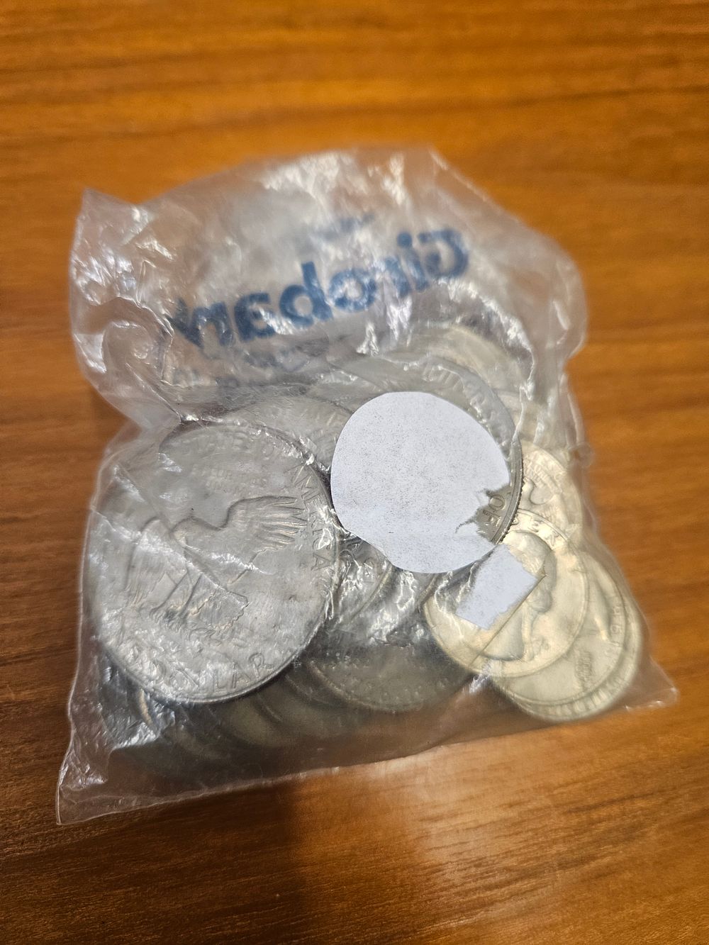 Lot 253 – A Group of US Coins Including Franklin Half Dollars and Eisenhower Dollars