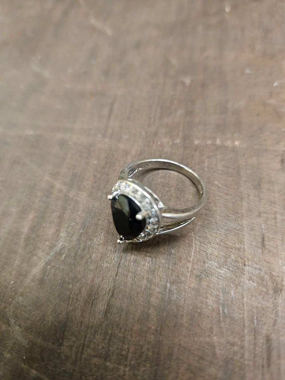 Lot 303 – 925 Silver Pear Cut Black Stone and Clear Stone Halo Cocktail Ring