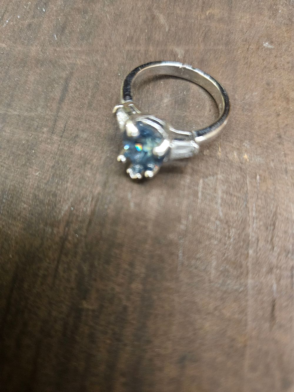 Lot 305 – A 925 silver three-stone ring with blue and colourless stones