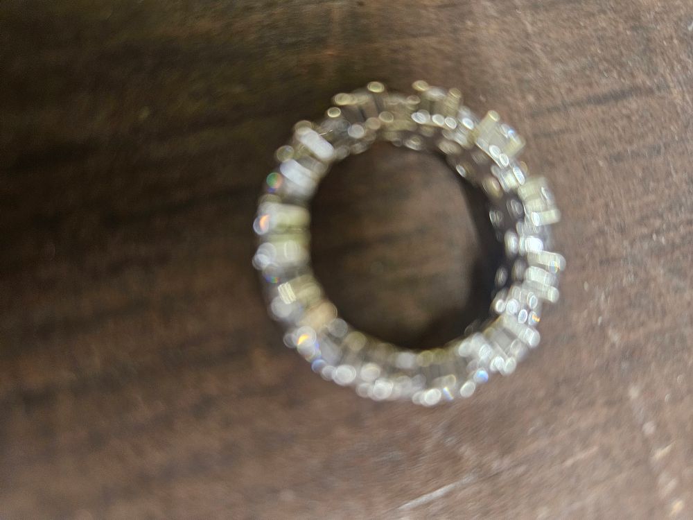 Lot 307 – A 925 silver eternity ring set with colourless stones