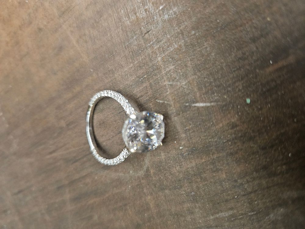 Lot 311 – A 925 Silver Solitaire Ring with Oval Cut Colourless Stone
