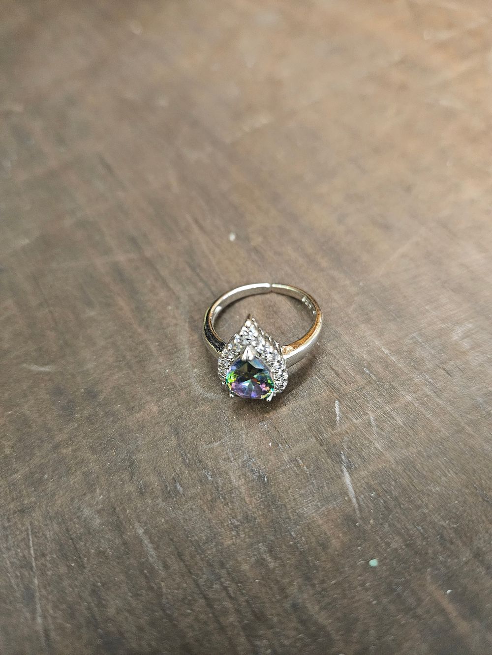 Lot 313 – A 925 silver cocktail ring featuring a pear-cut multi-coloured stone and clear faceted accents
