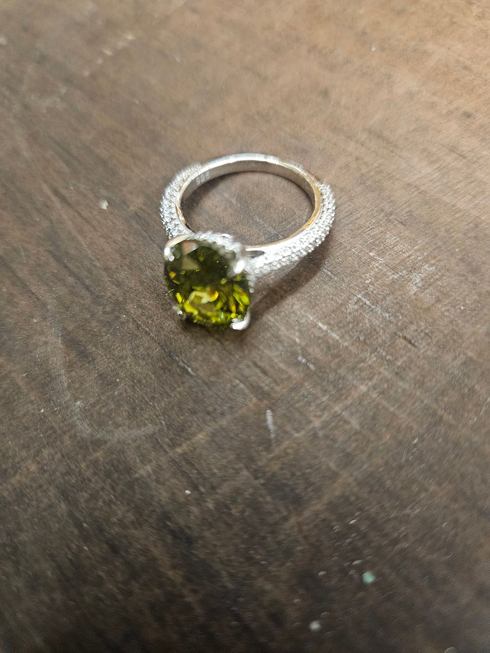 Lot 314 – 925 Silver Oval-Cut Green Stone and Halo Accent Cocktail Ring