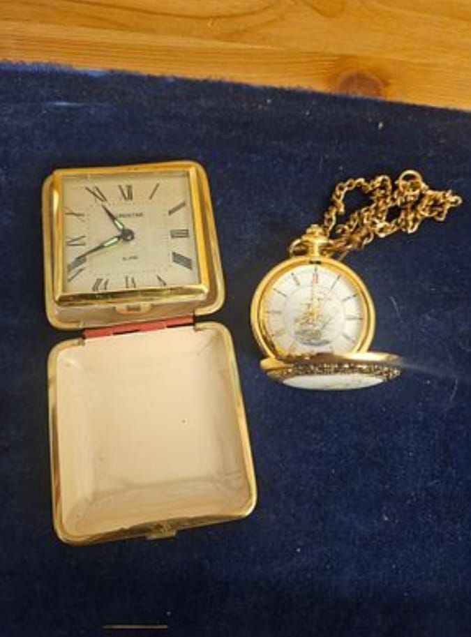 Lot 179 – Two gold-tone timepieces comprising a Eurostar folding travel alarm clock and a hunter-case pocket watch with chain