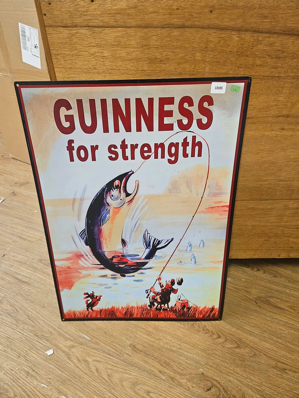 Lot 177 – A reproduction metal Guinness for strength advertising sign