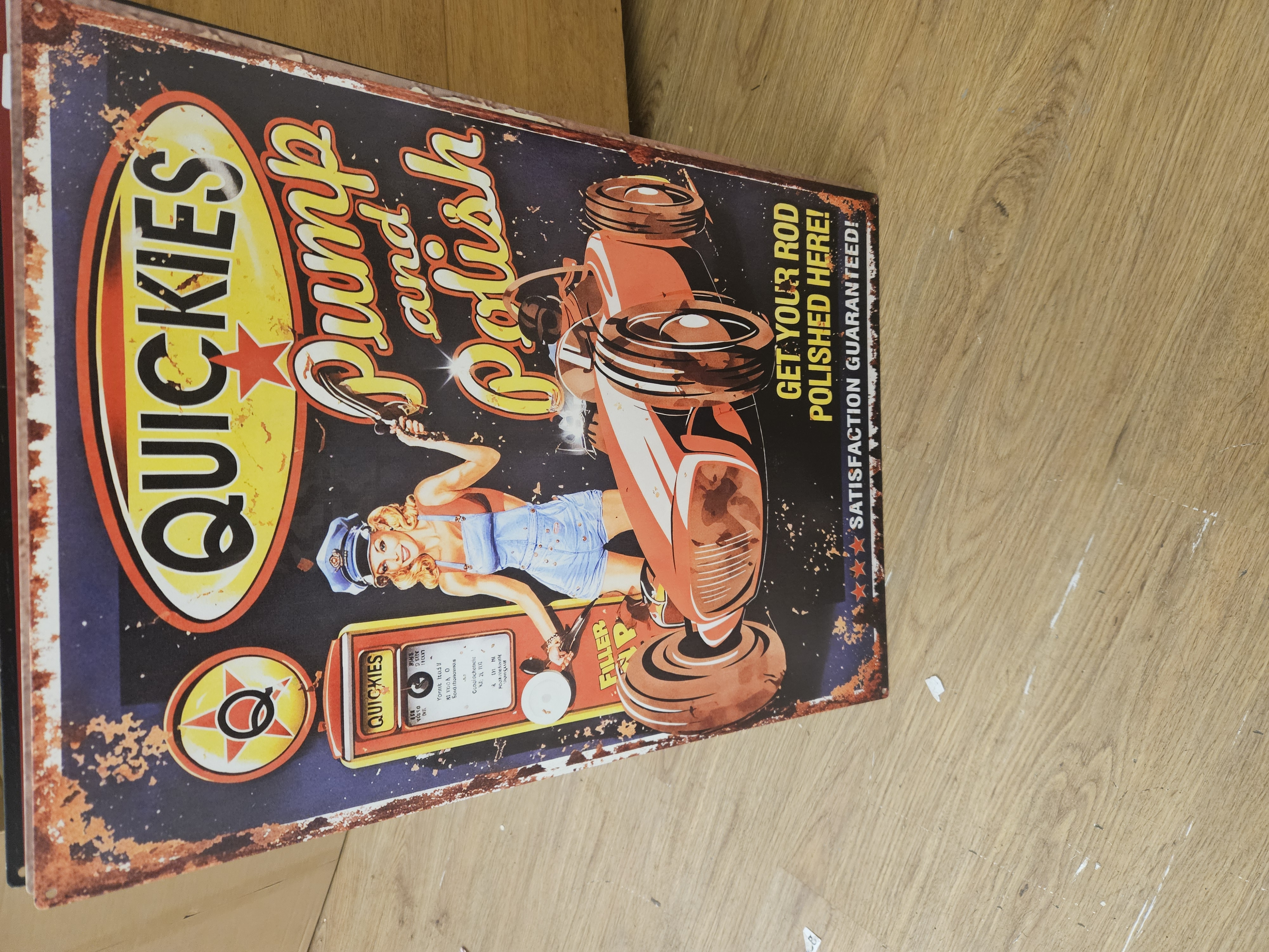 A Reproduction Tin Advertising Sign for Quickies Pump and Polish