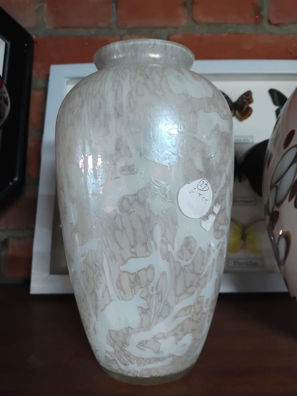 Lot 212 – An iridescent mottled white glass vase, attributed to Royal Brierley Studio