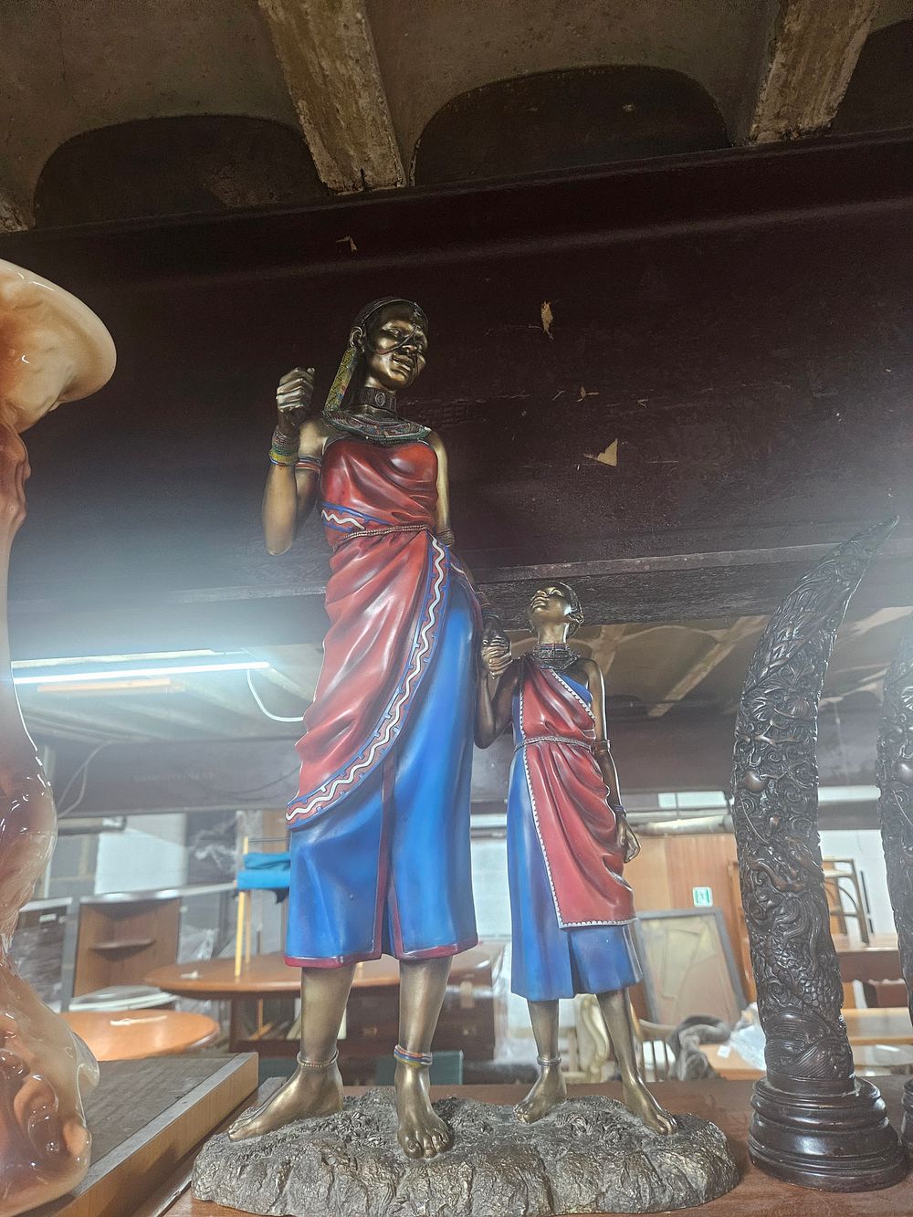 Lot 242 – A Large Cold-Cast Resin Polychrome Sculpture of Two East African Figures