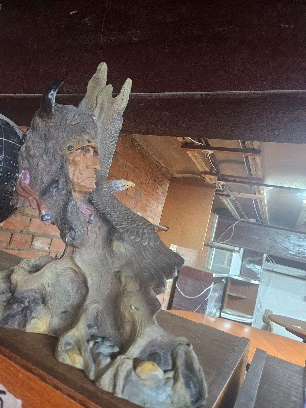 Lot 250 – A Large Painted Resin Sculpture of a Native American and Eagle in the Western Frontier Style