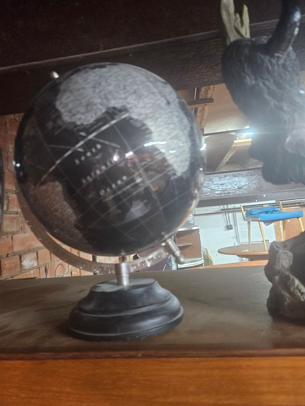 Lot 251 – A Contemporary Decorative Black and Silver World Globe on Stand