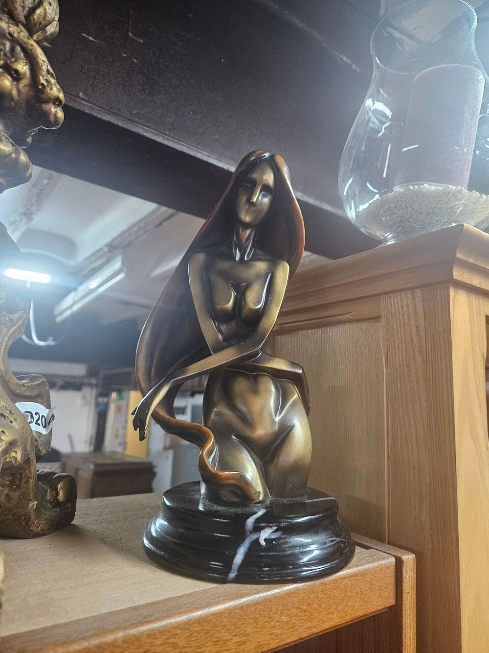 Lot 262 – A Modernist Style Bronze-Effect Resin Female Nude Sculpture on a Marble Plinth