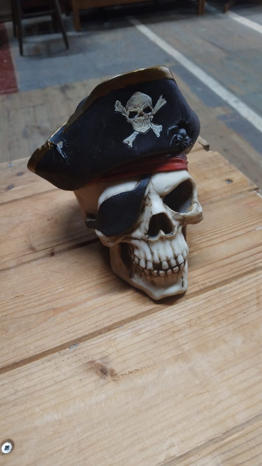 Lot 300 – A contemporary polychrome resin pirate skull novelty figurine