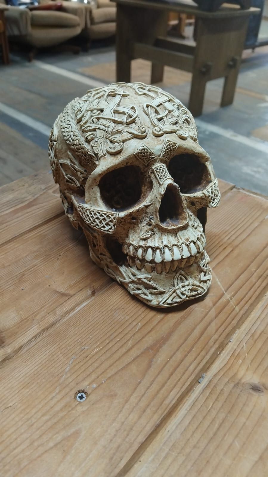 Lot 304 – A Contemporary Cast Resin Celtic Motif Decorative Skull