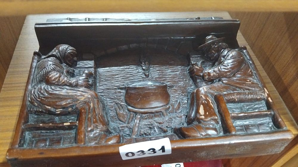 Lot 350 – Relief-Molded Faux-Wood Decorative Plaque Depicting a Hearth Scene