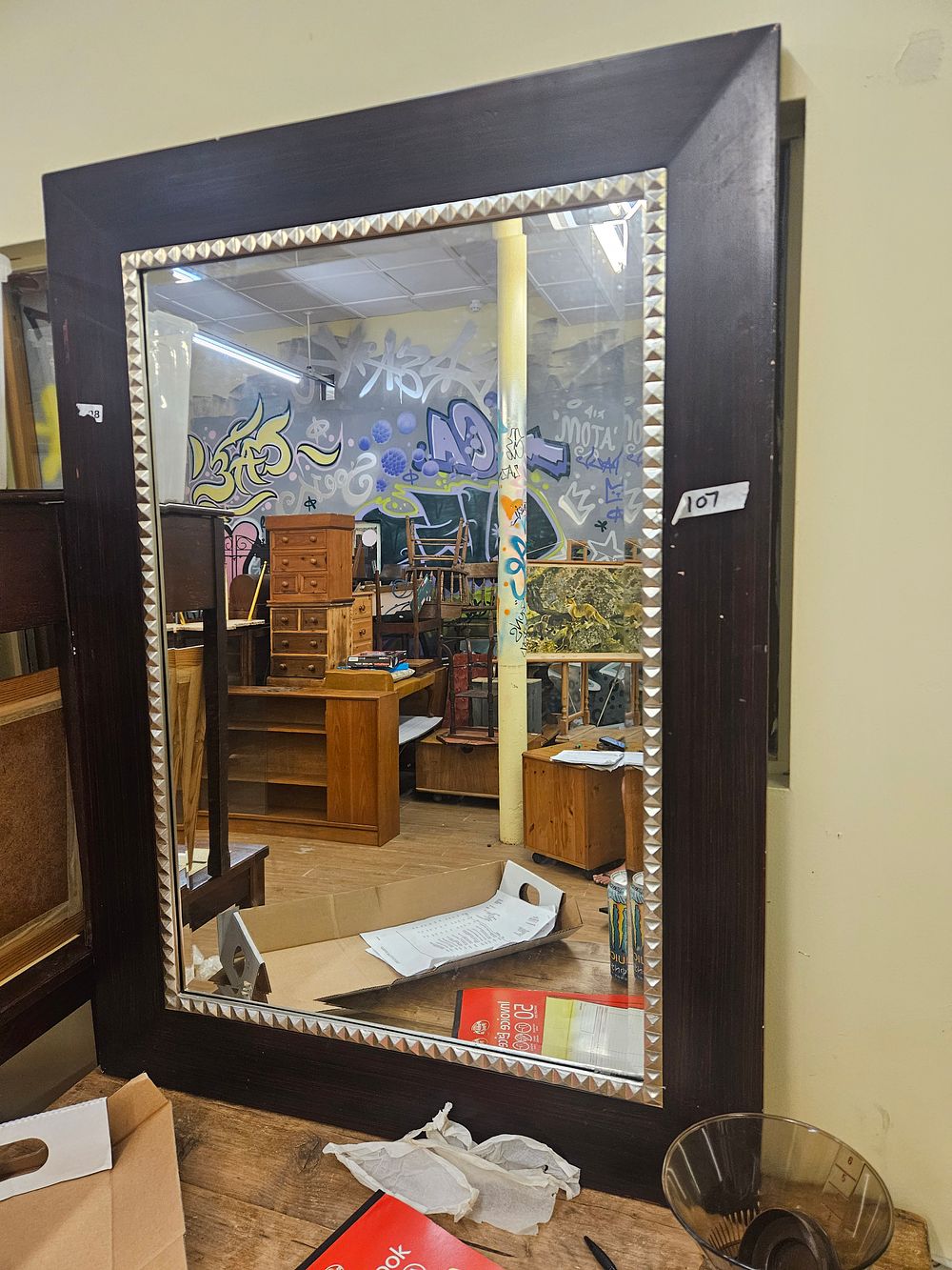 Lot 373 – A Large Contemporary Dark-Stained Wood Wall Mirror with Silvered Pyramid-Stud Inset