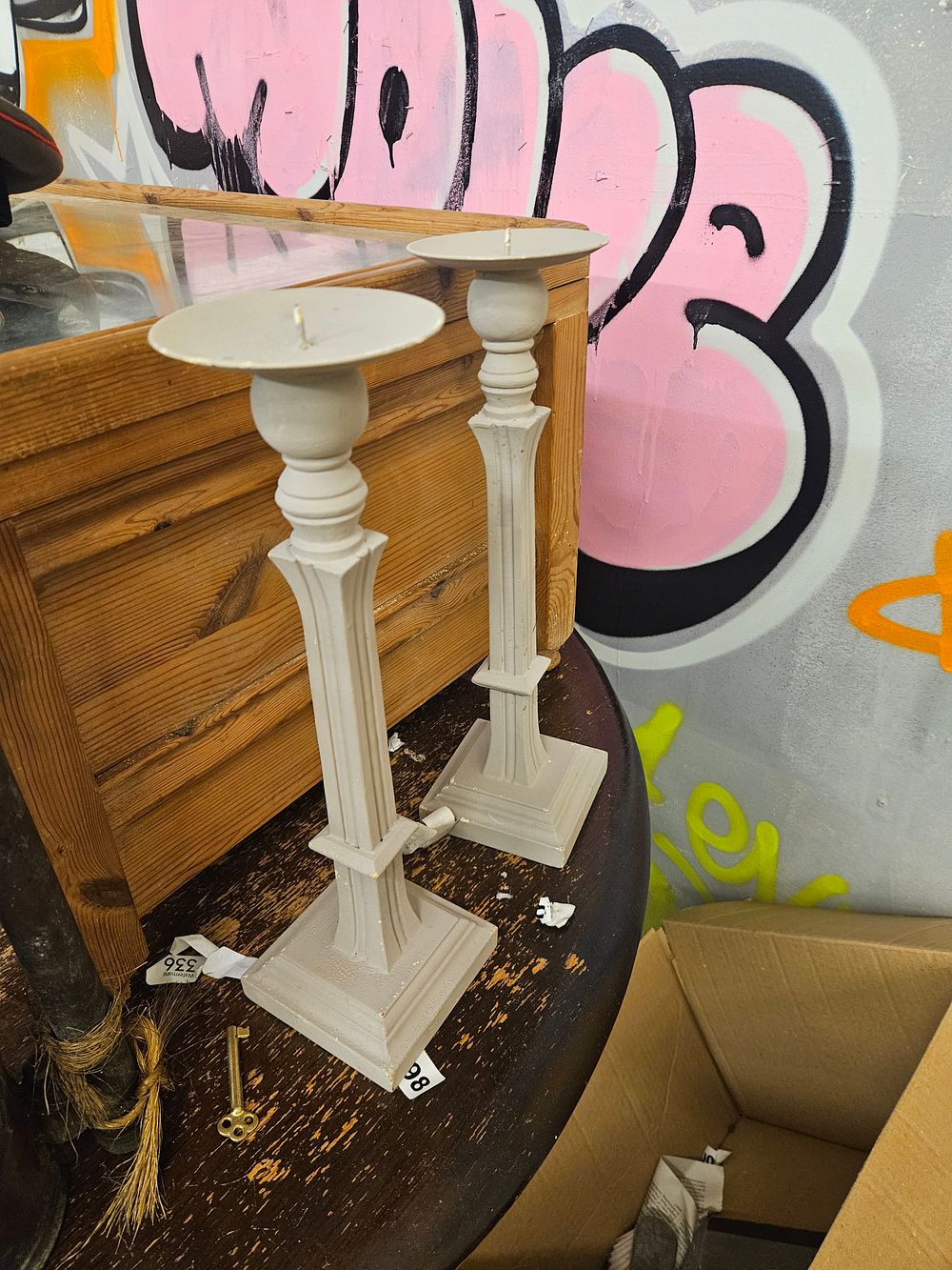 Lot 386 – A Pair of Neoclassical Style Painted Metal Candlesticks